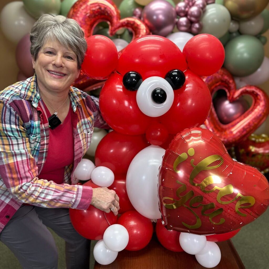 Dorothy of Festive Balloons with a Valentine's Day balloon bear decoration